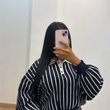 Pull rayé bouton