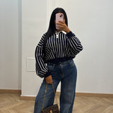 Pull rayé bouton